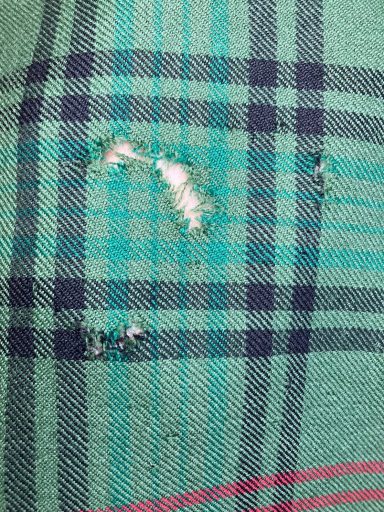 Invisible Mending - Kilt Expert Alterations Invisible mending on a traditional Scottish kilt, professionally repaired in Glasgow.